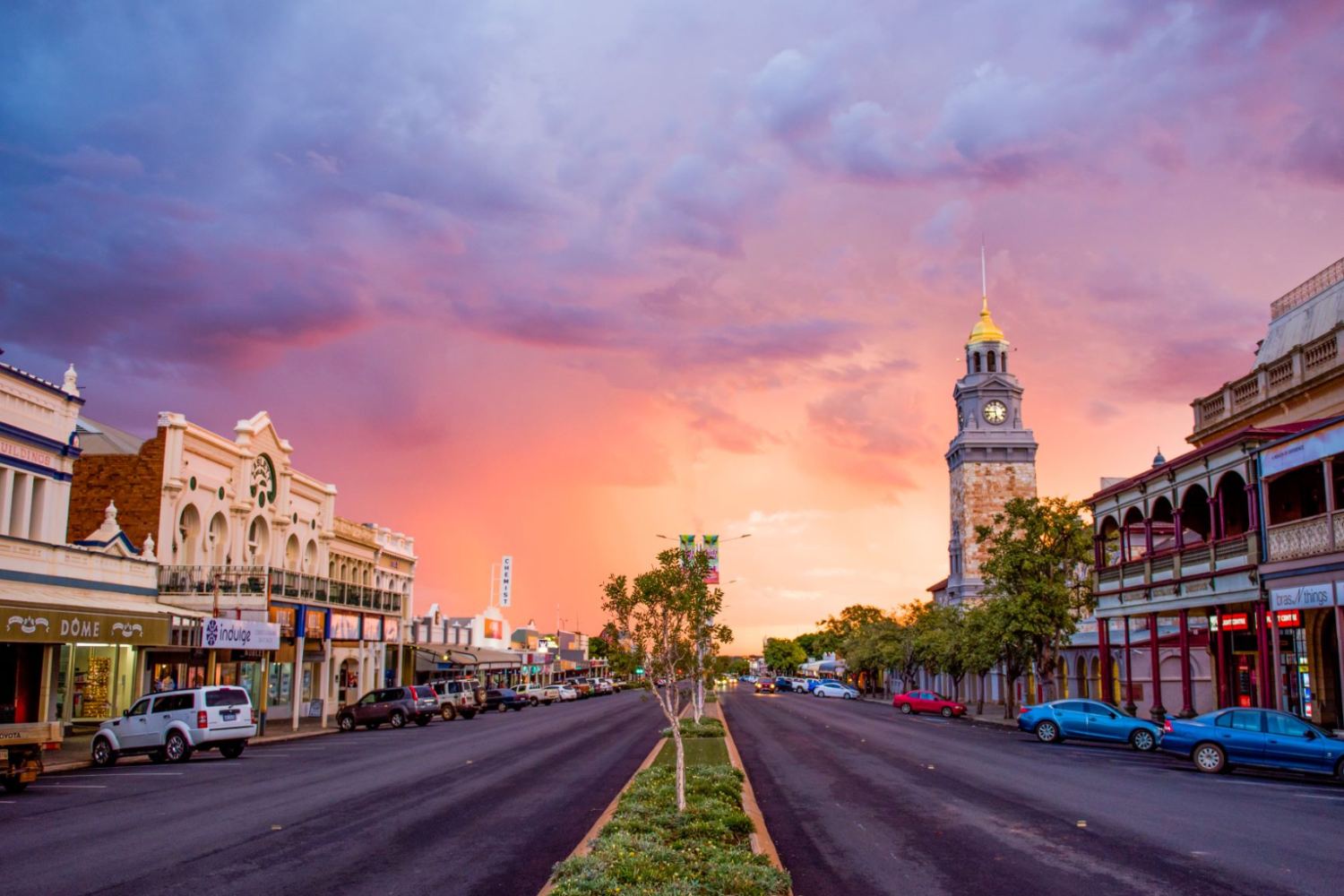 Hannan Street in Kalgoorlie at sunset with the town hall clock tower