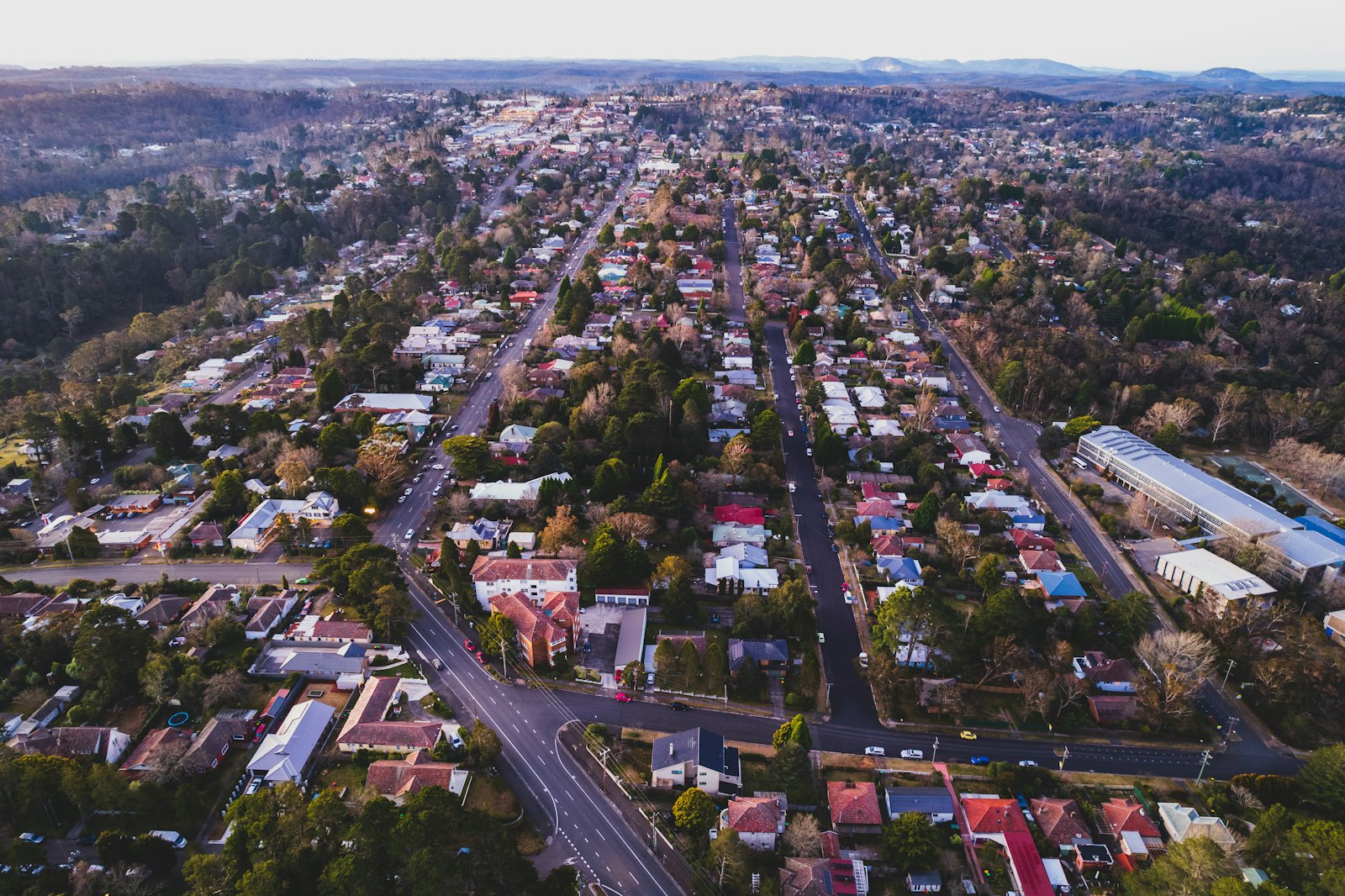 Aerial view of a regional town grid with red earth around it