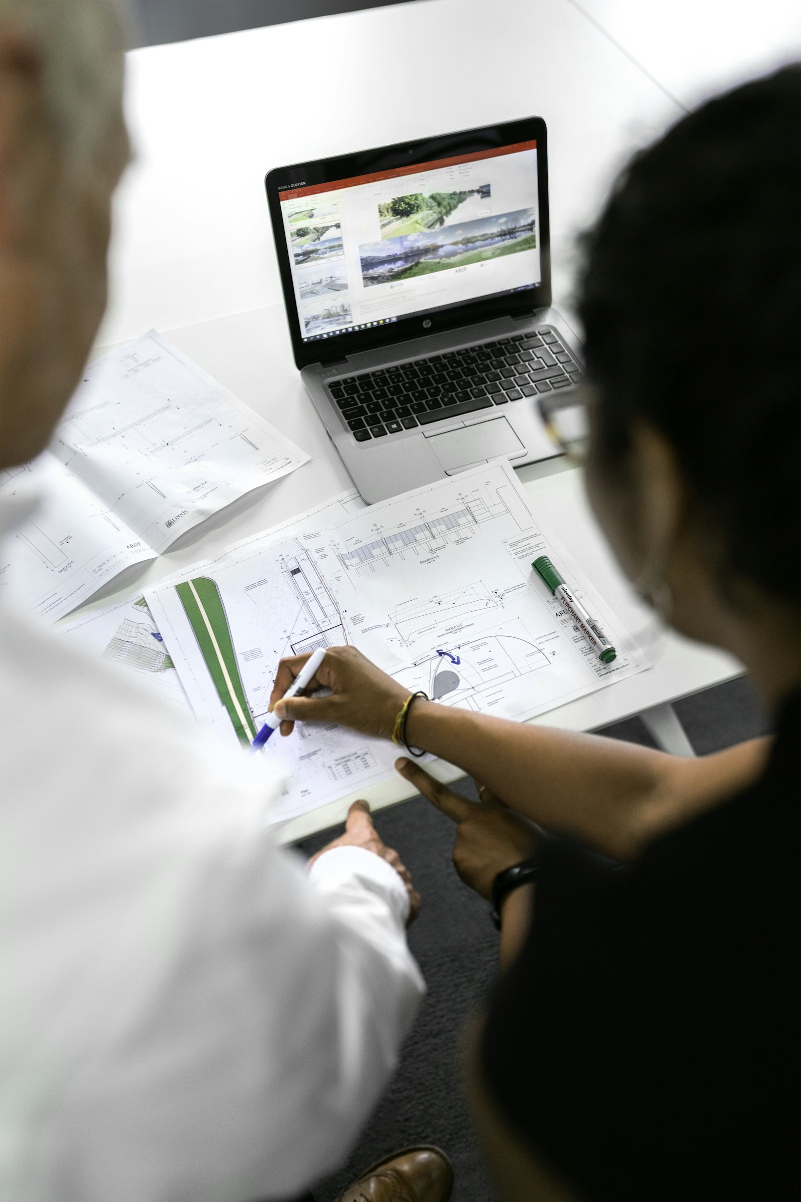 House plans and drawings spread on a table