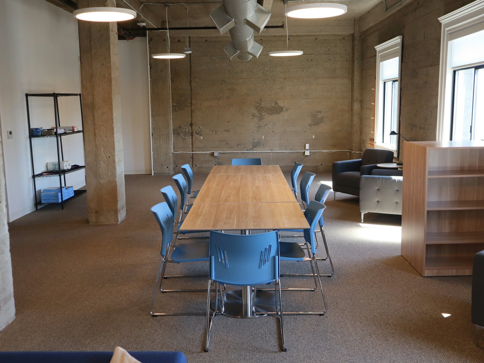 People in a meeting room discussing plans