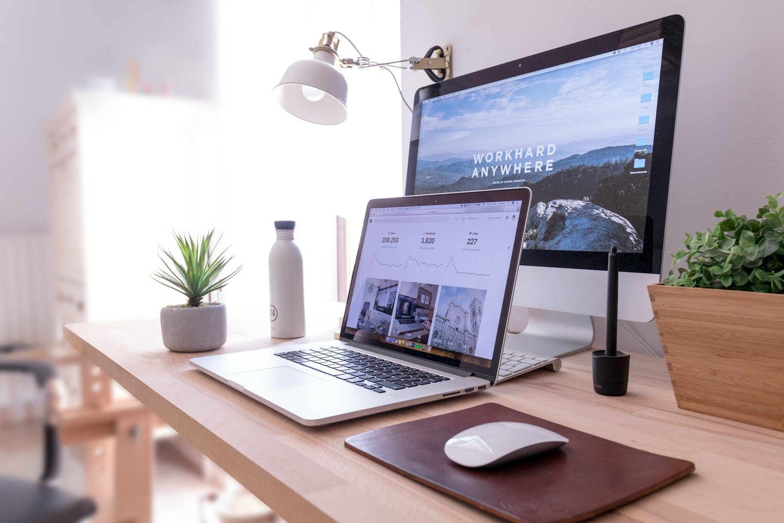 Web designer's desk with a large screen and keyboard