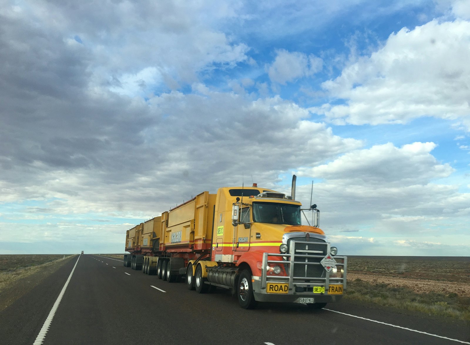 Road train driving along an outback highway