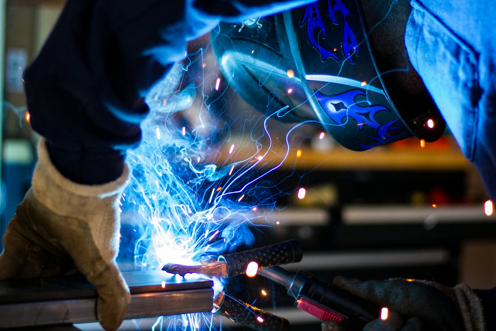 Welder at work with sparks flying