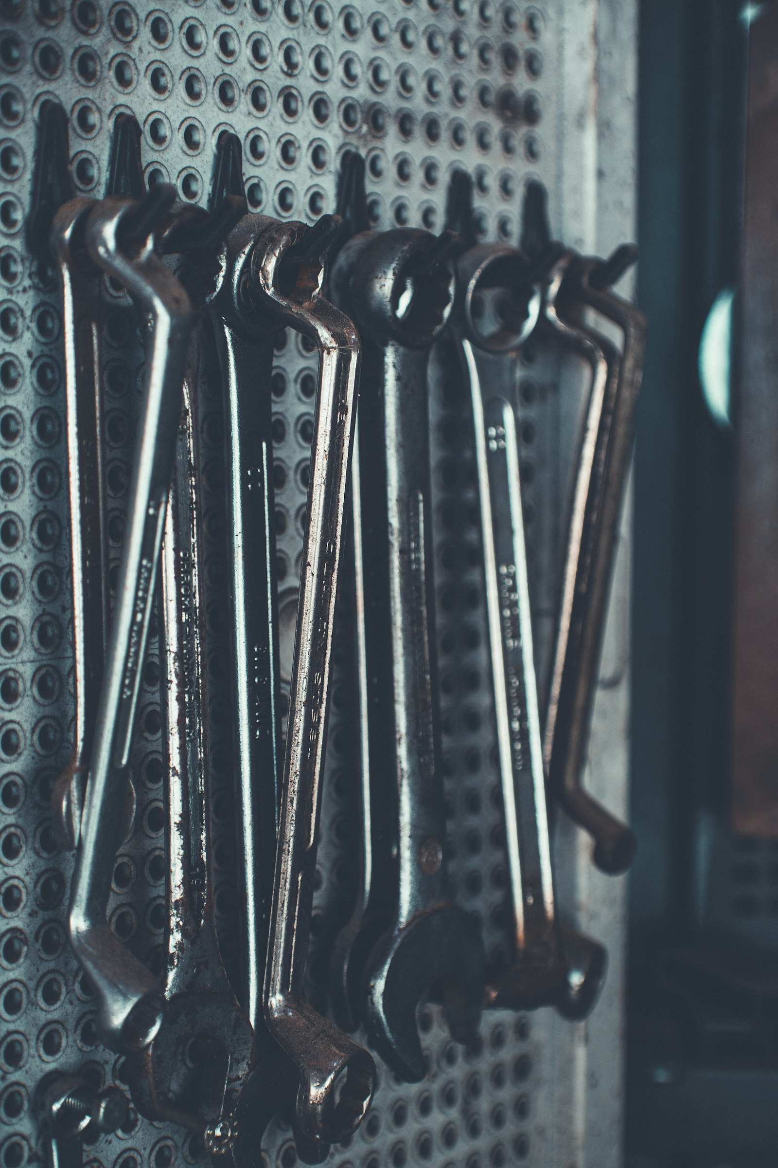 Set of wrenches laid out on a workbench